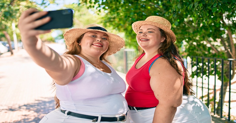 two plus sized girls taking a selfie